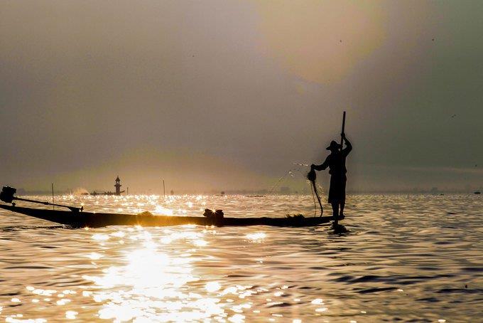 an Inle fisherman at sun rise