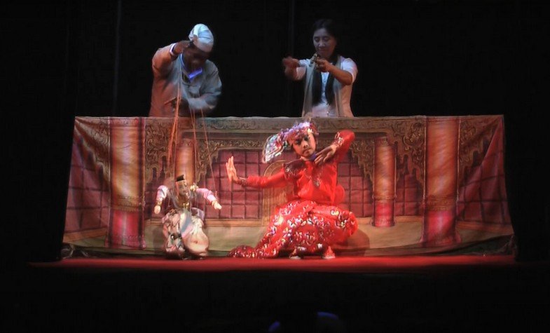 the artists are contolling the puppets in a Marionettes Show in Mandalay