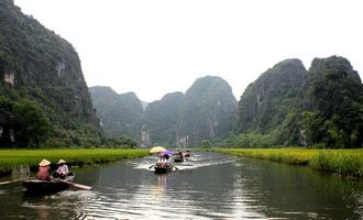 Boat rowing in Tam Coc, Ninh Binh, Vietnam