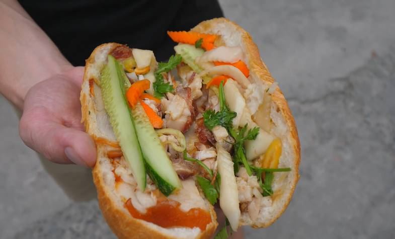 Banh mi Vietnam with bacon, cucumber and herbs