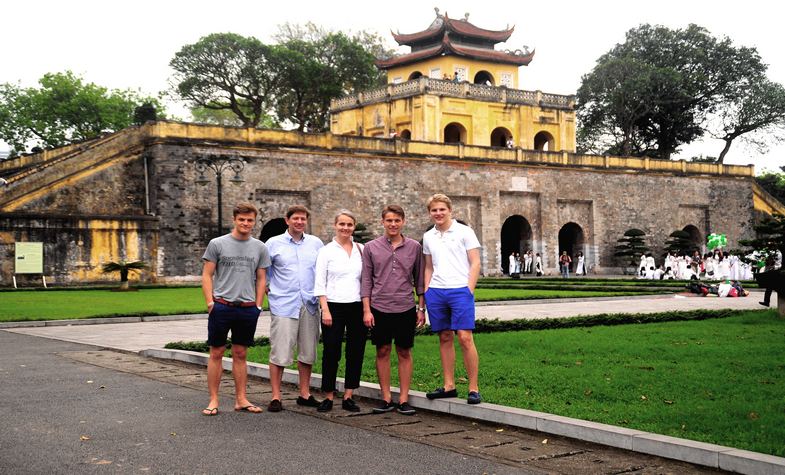 Clients taking photo in front of Hanoi Citadel