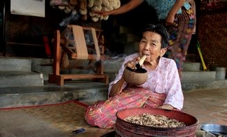 Lady smoking cheroot, Bagan, Myanmar travel
