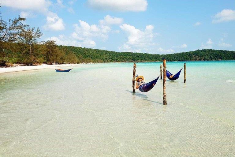 lying on hammocks above the sea water