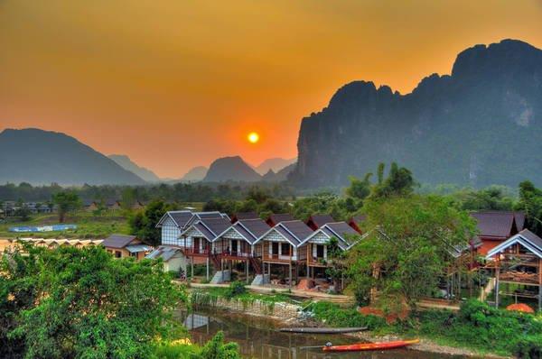 sunset, stilt houses