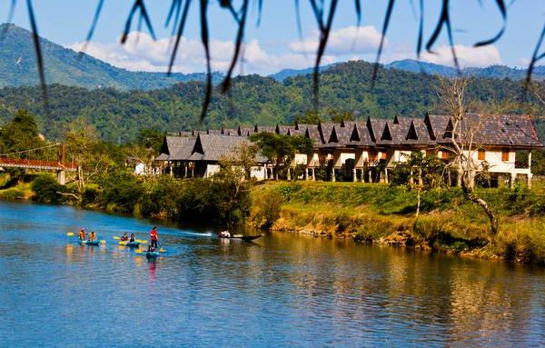 boats riding, stilt houses