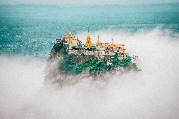 golden Taung Kalat is being surrounded with fog, on top of the mountain