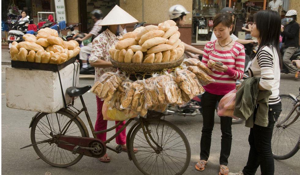 A woman sells Banh mi