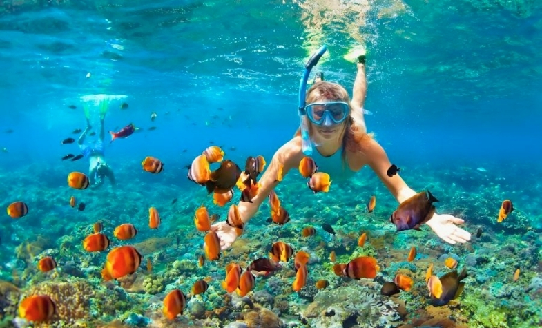Snorkeling in the clear waters of Koh Rong Island.
