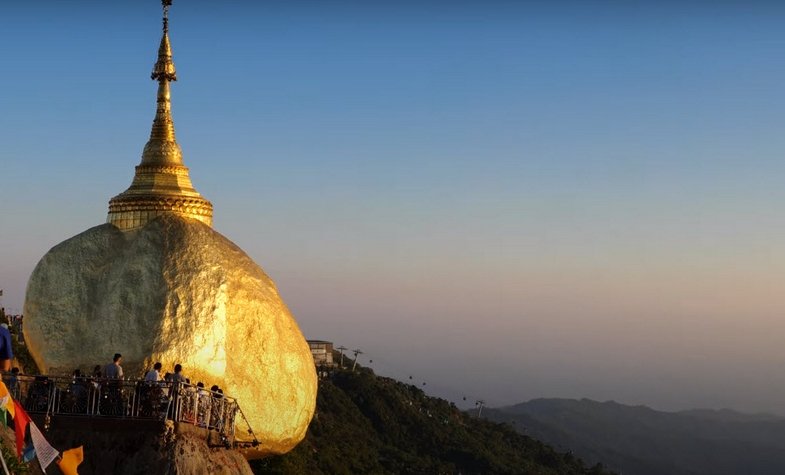 Golden Rock temple is perched on a giant rock on top of the mountain