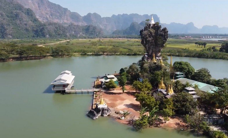 Kyauk Kalap Monastery observed from above with a lake surrounding