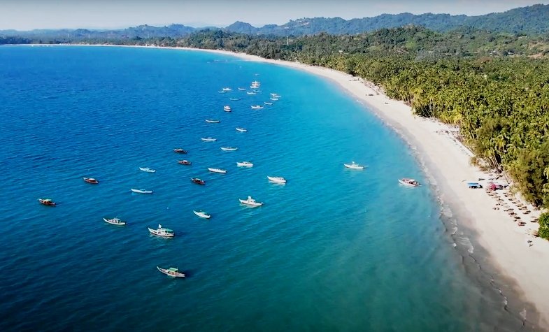 fishing boat on the beach, beside is the most beautifully white sandy beach of Ngapali