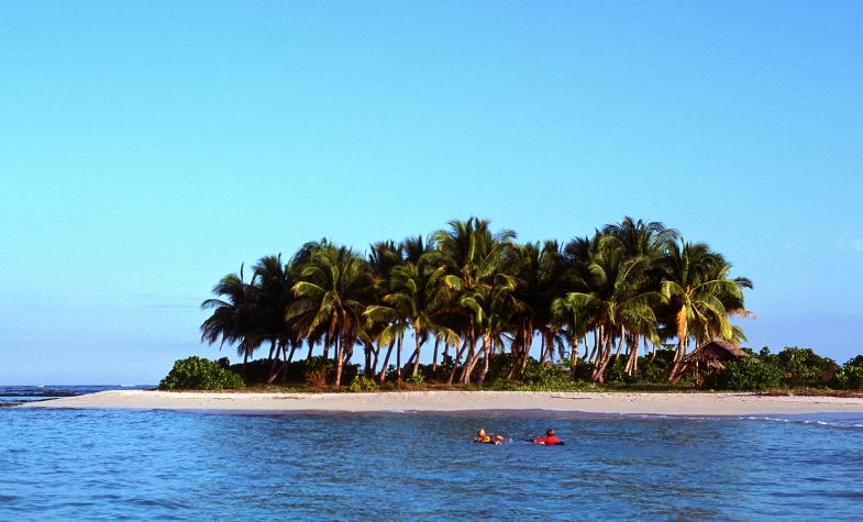 Island hopping near Siargao with white sand beaches and clear blue waters.