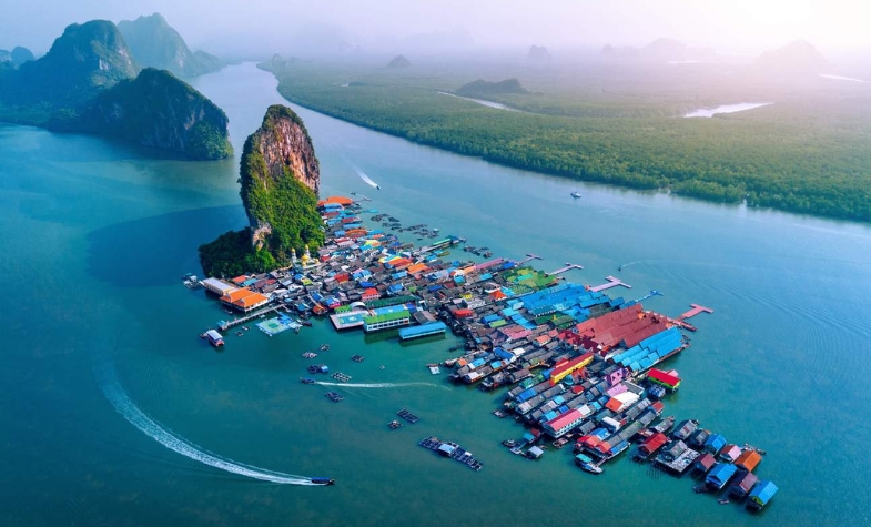 Limestone cliffs and turquoise water in Phang Nga Bay.