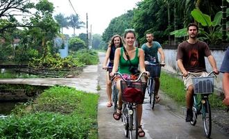 Cycling around village in Red River Delta 